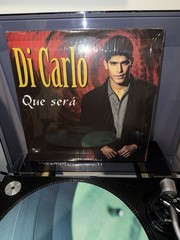 DI CARLO. (QUE SERA)