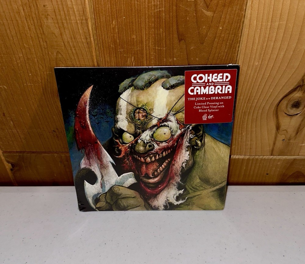 COHEED AND CAMBRIA – The Joke Deranged 7″ Coke Clear Blood Splatter Vinyl SEALED
